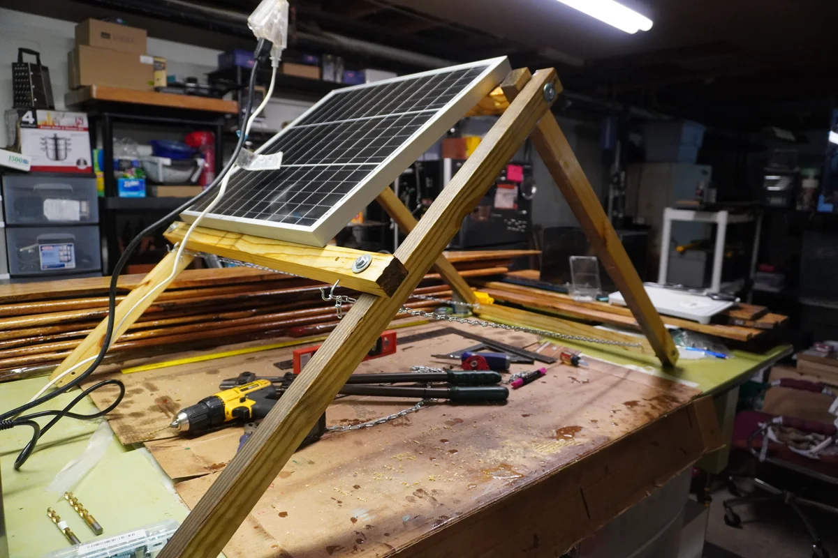 Workbench staging for shed solar hardware and field system preparation.